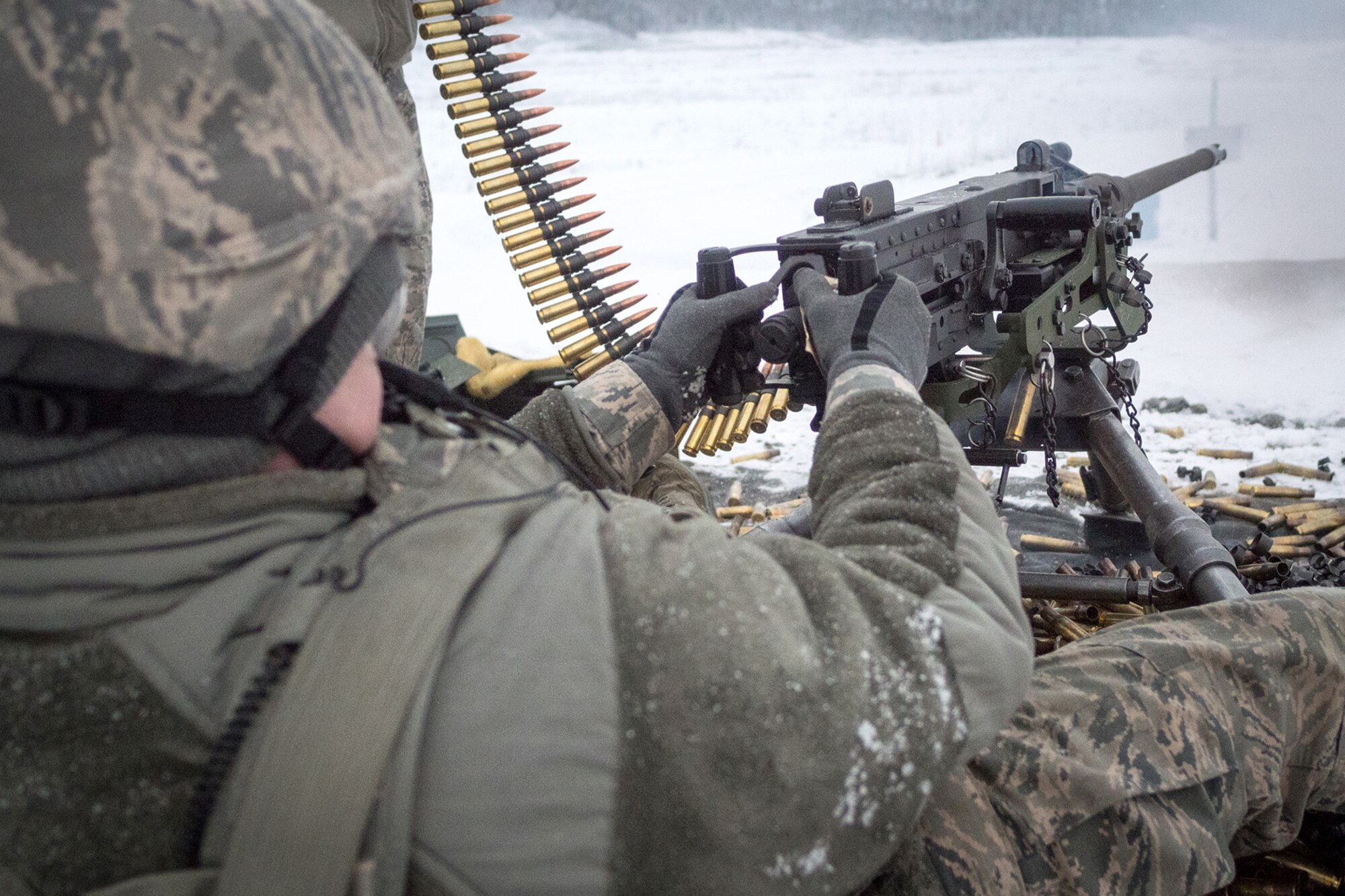 An Airman assigned to the 673d Security Forces Squadron fires an M2 .50 Caliber machine gun during a qualification range on Joint Base Elmendorf-Richardson, Alaska, Jan. 10, 2018. Security Forces Airmen perform extensive training in law enforcement as well as combat tactics to protect U.S. Military bases and assets both stateside and overseas.