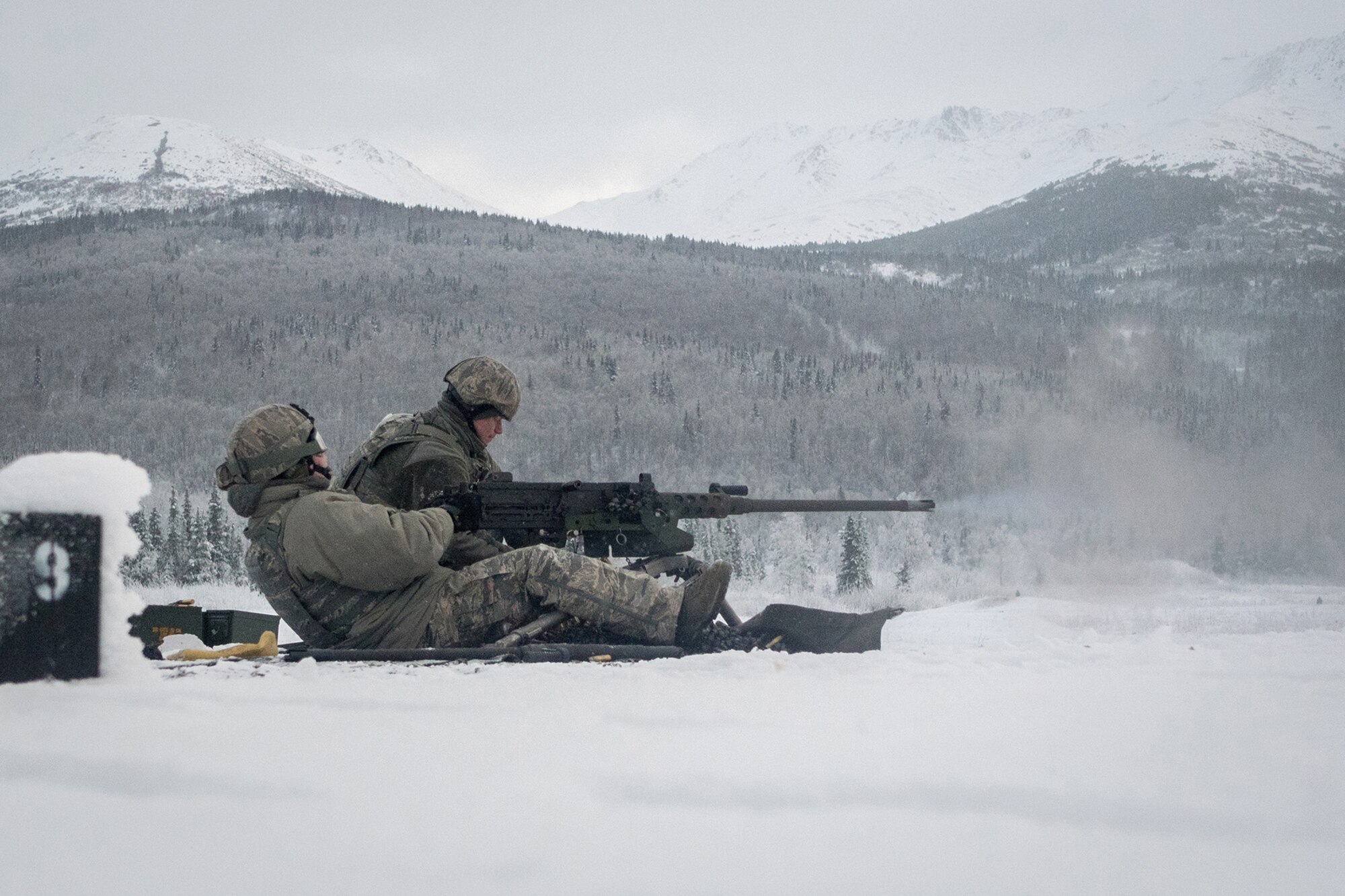 Airmen assigned to the 673d Security Forces Squadron conduct an M2 .50 Caliber machine gun qualification range on Joint Base Elmendorf-Richardson, Alaska, Jan. 10, 2018. Security Forces Airmen perform extensive training in law enforcement as well as combat tactics to protect U.S. Military bases and assets both stateside and overseas.