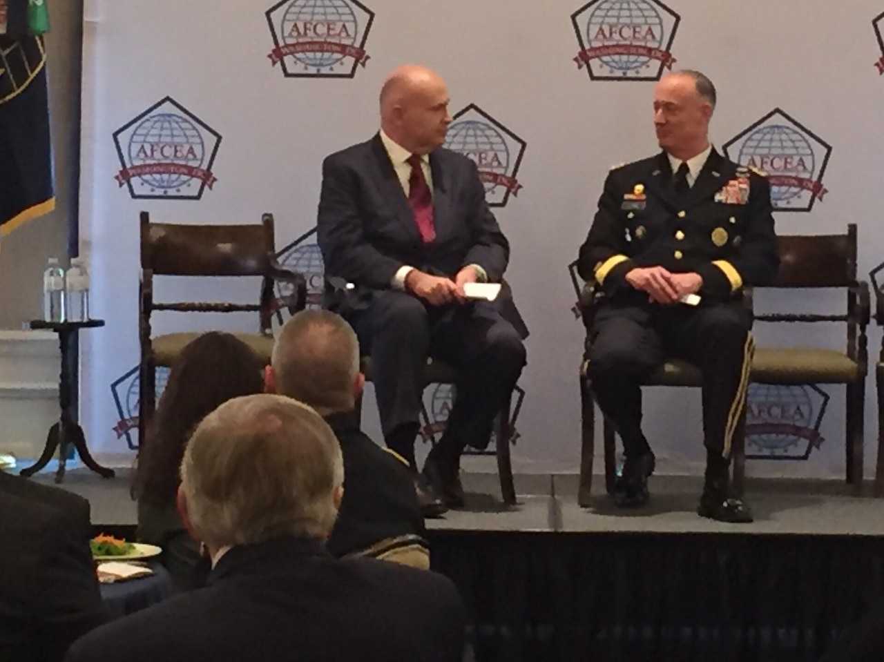 Washington television host Francis Rose, left, moderates a discussion with Army Lt. Gen. Alan R. Lynn, director of the Defense Information Systems Agency.