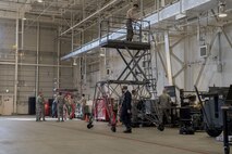 Airmen work in the 374th Maintenance Squadron aerospace ground equipment inspections section, Jan. 10, 2018, at Yokota Air Base, Japan.