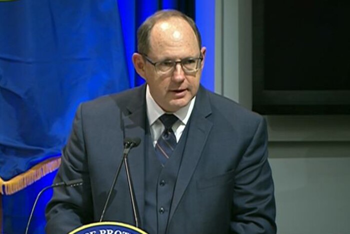 Anthony M. Kurta, deputy assistant secretary of defense for military personnel policy, speaks from behind a lectern.