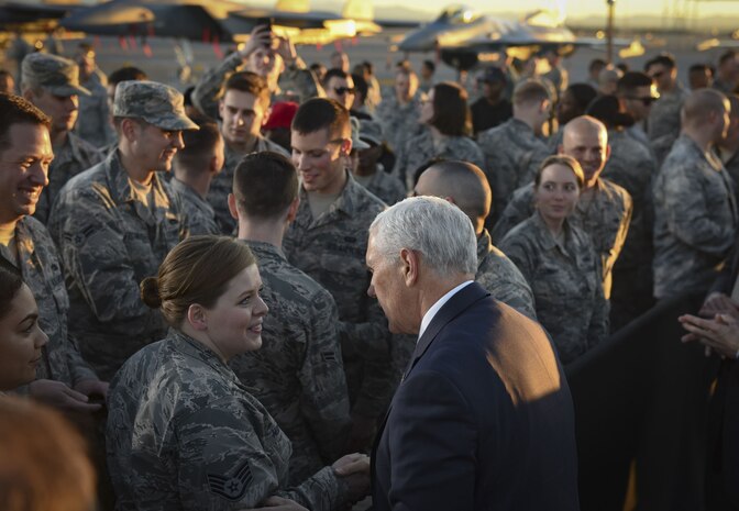 Vice President Mike Pence greets Staff Sgt. Samantha Henry, 99th Force Support Squadron dorm manager, following his address to Airmen at Nellis Air Force Base, Nevada, Jan. 11, 2018. As the sun set on the desert horizon, the vice president made his way through the crowd, shaking hands and snapping photos with the Airmen. (U.S. Air Force photo by Airman 1st Class Andrew Sarver)