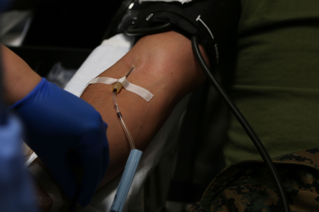 CAMP FOSTER, OKINAWA, Japan – A needle and tubing is taped down Jan. 11 at the Single Marine Program blood drive aboard Camp Foster, Okinawa, Japan.