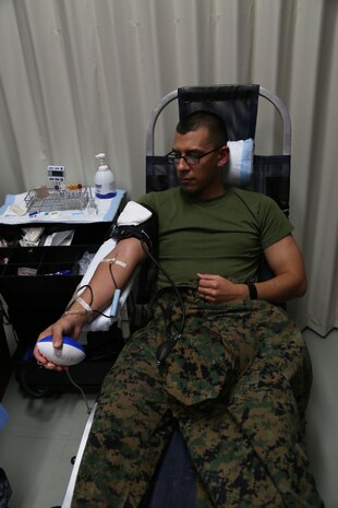 CAMP FOSTER, OKINAWA, Japan – Staff Sgt James Hernandez donates blood Jan. 11 at the Single Marine Program blood drive aboard Camp Foster, Okinawa, Japan.