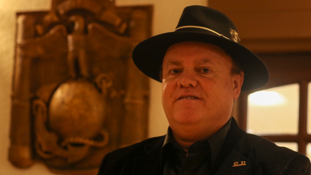 Claudio D’Augustino stands in front of his sculpture during a dedication ceremony at the Officers’ Club aboard the Marine Corps Air Ground Combat Center, Twentynine Palms, Calif., Jan. 9, 2018. The sculpture was donated to the Combat Center during the ceremony to express D’Augustino’s appreciation for members of the armed services.