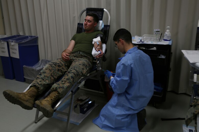 CAMP FOSTER, OKINAWA, Japan – Lance Cpl. Jarrid Young donates blood Jan. 11 at the Single Marine Program blood drive aboard Camp Foster, Okinawa, Japan.