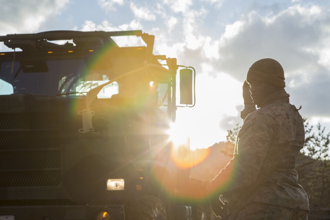 A U.S. Marine Corps Cpl. Dayshawn Franklin, a motor transport operator with Marine Wing Support Squadron (MWSS) 171, guides an MK-28 extended cargo truck during exercise Kamoshika Wrath 18-1 at Japanese Ground Self-Defense Force Maneuver Area, Haramura Higashihiroshima, Japan, Jan. 10, 2018. Kamoshika Wrath is a biannual, unit-level training exercise that focuses on providing field operation services and establishing a FOB. Additionally, it serves MWSS-171 as a building block for increasing squadron proficiency in command and control.
