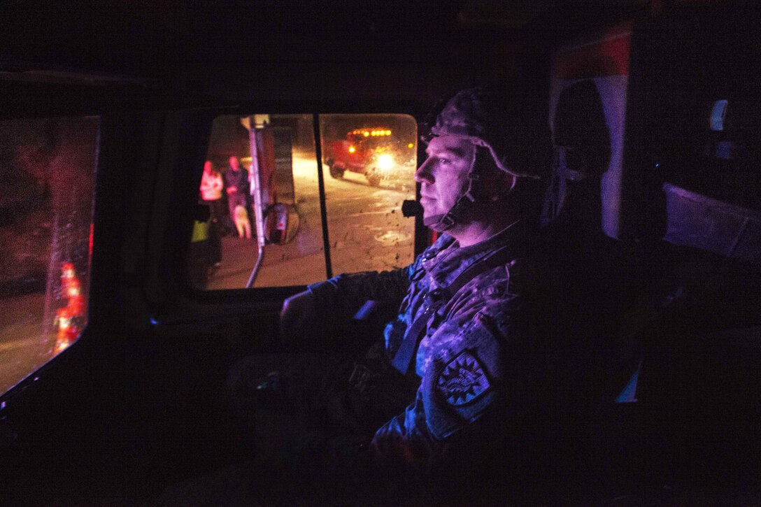 Army Sgt. Charles Sears rides in a light medium tactical vehicle in Montecito.