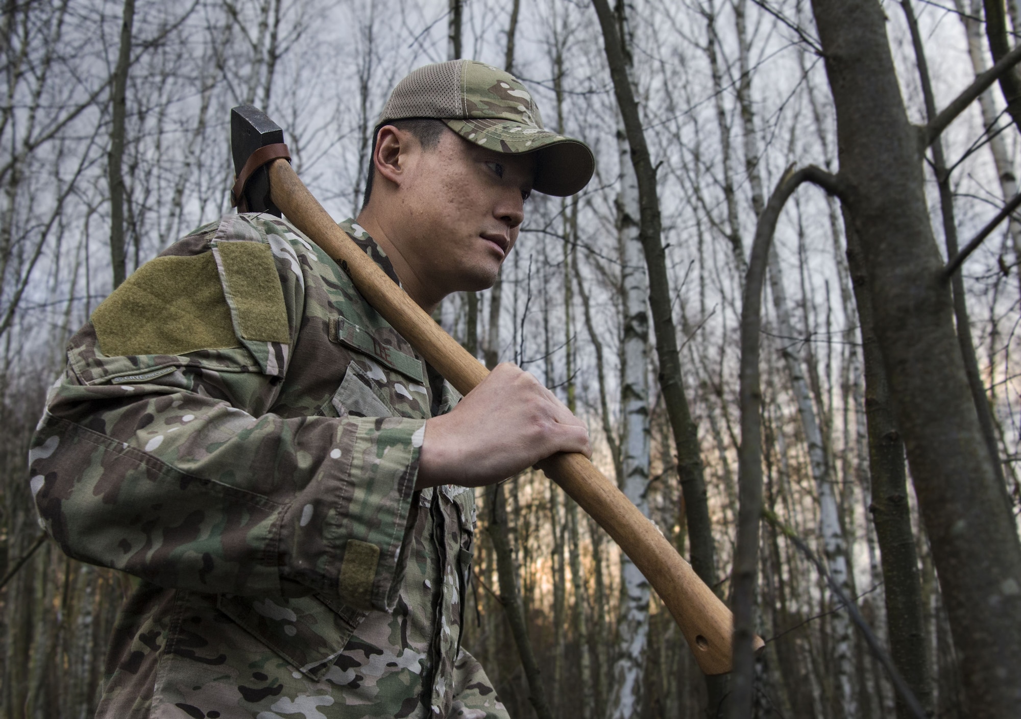 U.S. Air Force TSgt. Lee Young, 86th Operations Group Survival, Evasion, Resistance, and Escape noncommissioned officer in charge, walks through the woods on Ramstein Air Base, Germany, Jan. 11, 2018. Lee, who has trained approximately 2,000 personnel on how to stay alive in austere conditions, believes that survival is 10 percent physical and 90 percent mental. (U.S. Air Force illustration by Senior Airman Elizabeth Baker)