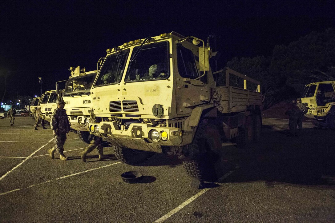 Guardsmen prepare their light medium tactical vehicles that are staged at the Earl Warren Showgrounds.