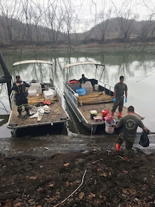 U.S. Army Staff Sgt. Shay Rich and Sgt. Nick Thongdara of the West Virginia National Guard's 35th Civil Support Team (Weapons of Mass Destruction) collect water samples from the Big Sandy River just south of Kenova in Wayne County, W.Va. Jan. 11, 2018.