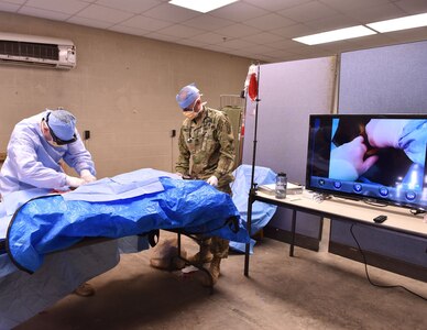 Navy Lt. Cmdr. C. Long, a Special Operations Forces physician assistant, performs a surgical procedure to stop the bleeding at the femoral artery on a manikin during training using augmented reality glasses, May 11, 2017. The Army recently opened a centralized virtual health medical center to promote the advancement of virtual health technology at Brooke Army Medical Center at Joint Base San Antonio-Fort Sam Houston, Jan. 4, 2018.