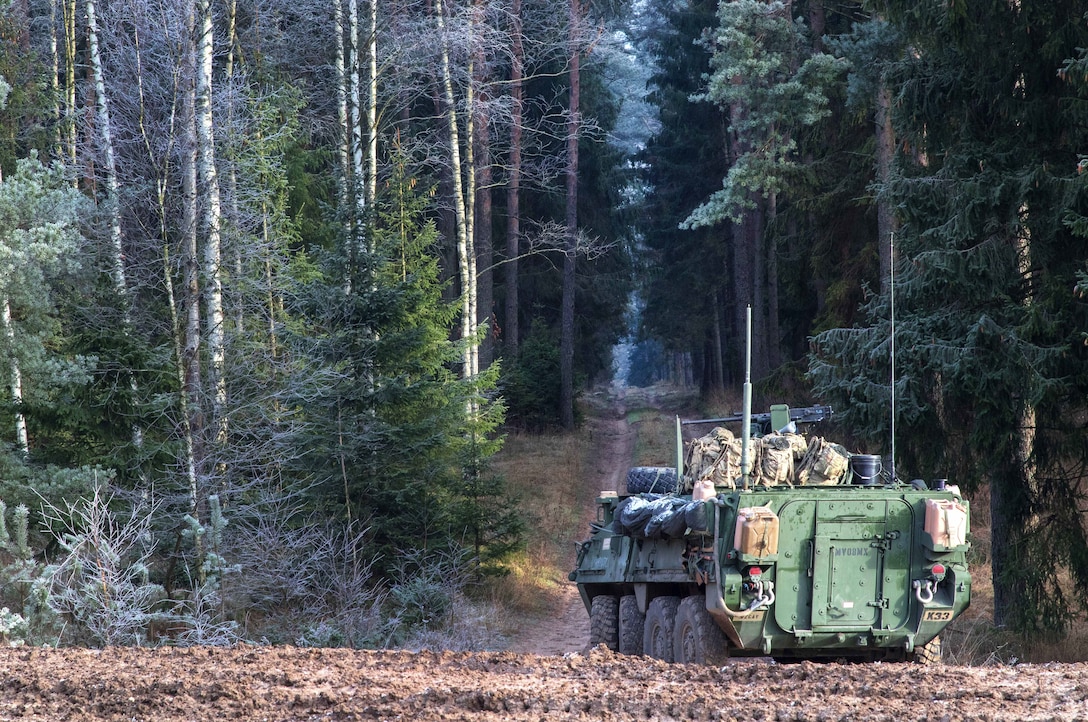 Soldiers maneuver their Stryker vehicle into a defensive position to provide security along a road during Bull Run III.