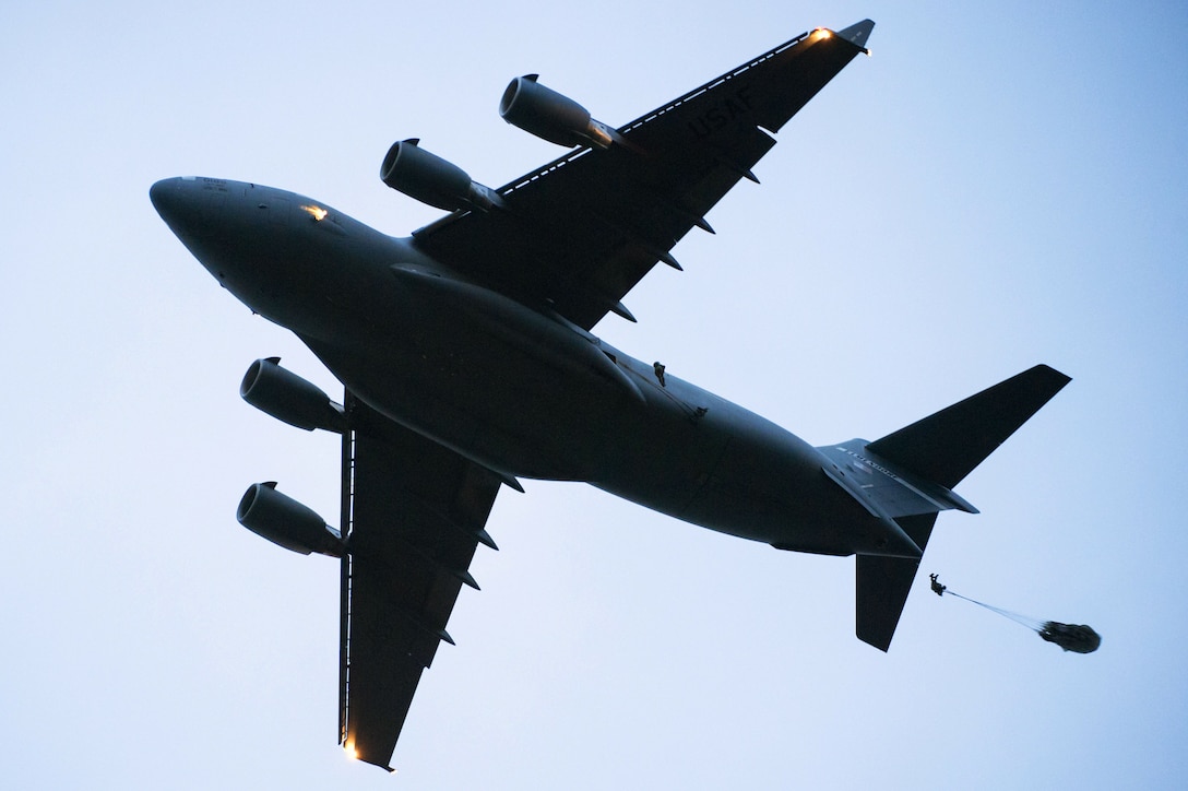 Tactical air control party specialists, assigned to the 3rd Air Support Operations Squadron, jump from a C-17 Globemaster III while conducting airborne jump training over Malemute drop zone at Joint Base Elmendorf-Richardson, Alaska, May 18, 2017. The C-17 Globemaster III was operated by Airmen assigned to the 517th Airlift Squadron. (U.S. Air Force photo by Alejandro Pena)