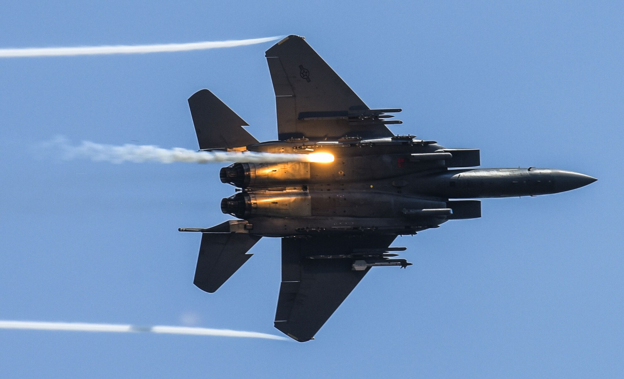 An F-15E Strike Eagle releases flares as part of a combined arms demonstration during the Wings Over Wayne Air Show, May 21, 2017, at Seymour Johnson Air Force Base, N.C. The demonstration showcased both the air-to-air and air-to-ground capabilities of the Strike Eagle. (U.S. Air Force photo by Staff Sgt. Brittain Crolley)