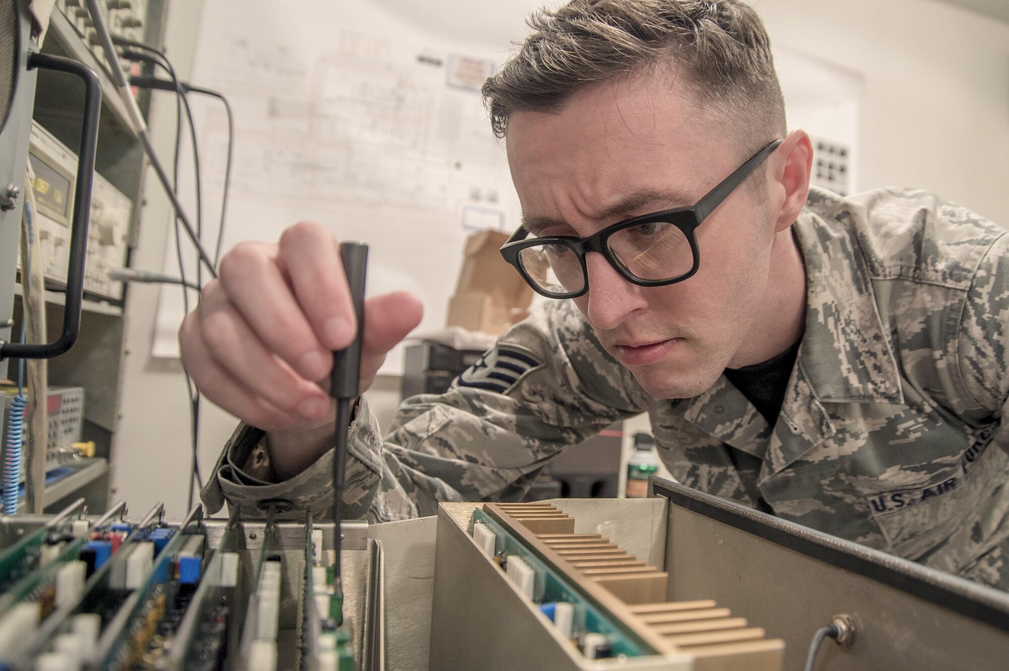 Staff Sgt. Roger Linder, a 375th Operations Support Squadron airfield systems supervisor, aligns a monitor for a tactical air navigation. Doing this ensures the TACAN transponder is transmitting the correct azimuth, identification and distance to aircraft within 200 nautical miles. (U.S. Air Force photo by Airman 1st Class Daniel Garcia)