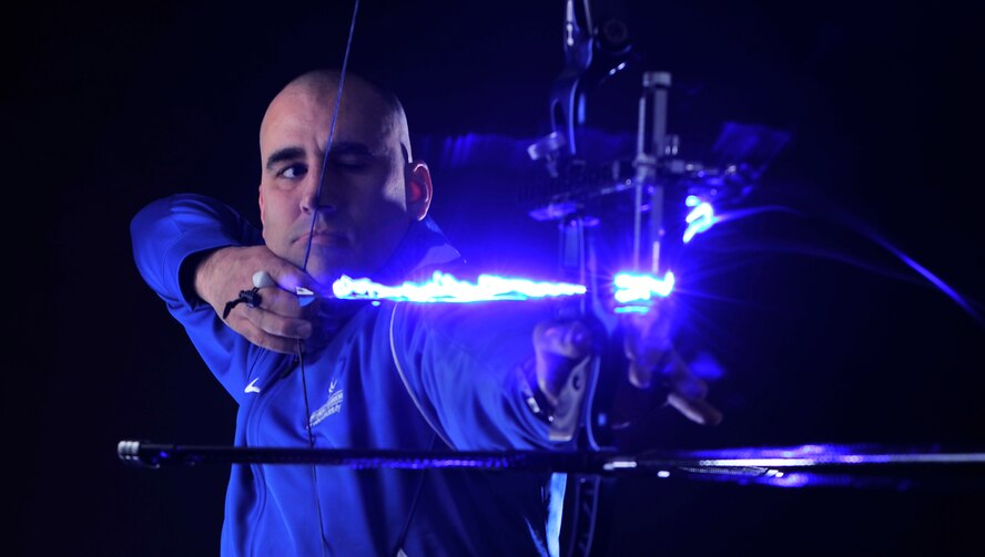 Tech. Sgt. Michael Christiansen, a 100th Security Forces Squadron assistant flight chief, draws back a bow and arrow March 28, 2017, at RAF Mildenhall, England. Christiansen was selected to represent U.S. Air Forces in Europe at the 2017 Department of Defense Warrior Games in Chicago where he will compete in the rifle, pistol, recurve archery and sitting volleyball events. (U.S. Air Force photo by Staff Sgt. Micaiah Anthony)