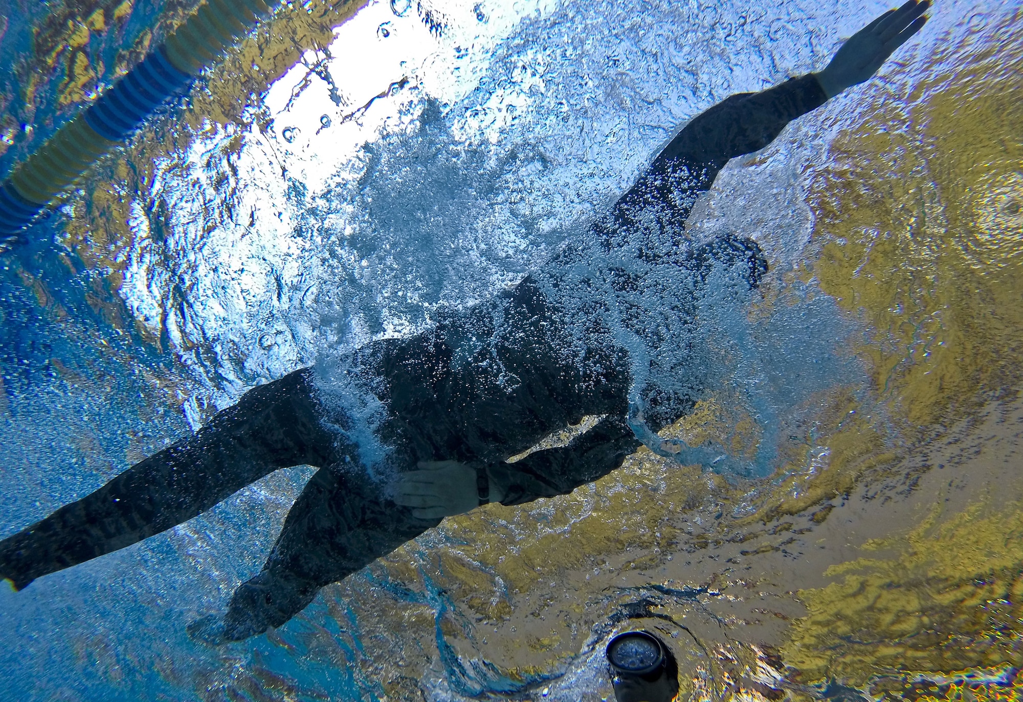 An Airman with the New Jersey Air National Guard's 108th Security Forces Squadron swims the 100 meter challenge during a German Armed Forces Badge for Military Proficiency test at Joint Base McGuire-Dix-Lakehurst, N.J., June 13, 2017. The test included a 1x10-meter sprint, flex arm hang, 1,000 meter run, 100 meter swim in military uniform, marksmanship and a timed foot march. (U.S. Air National Guard photo by Master Sgt. Matt Hecht)