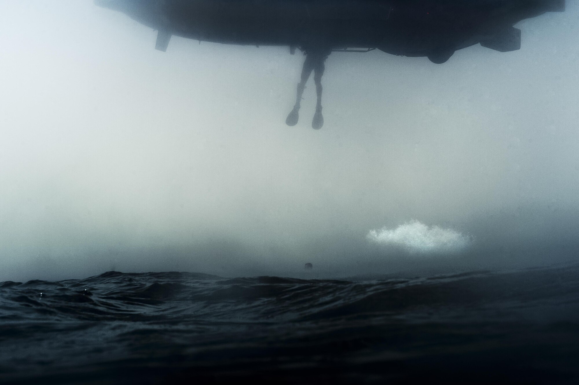 A French air force Aérospatiale SA 330 Puma helicopter hovers over the Gulf of Tadjoura during a bilateral water operations exercise with pararescuemen from the 82nd Expeditionary Rescue Squadron, assigned to Combined Joint Task Force-Horn of Africa July 24, 2017. The results of the exercise will aid in the development of standard operating procedures between CJTF-HOA and the French forces stationed in Djibouti for the U.S. and France’s rescue capabilities within the Horn of Africa region. (U.S. Air Force photo by Master Sgt. Russ Scalf)
