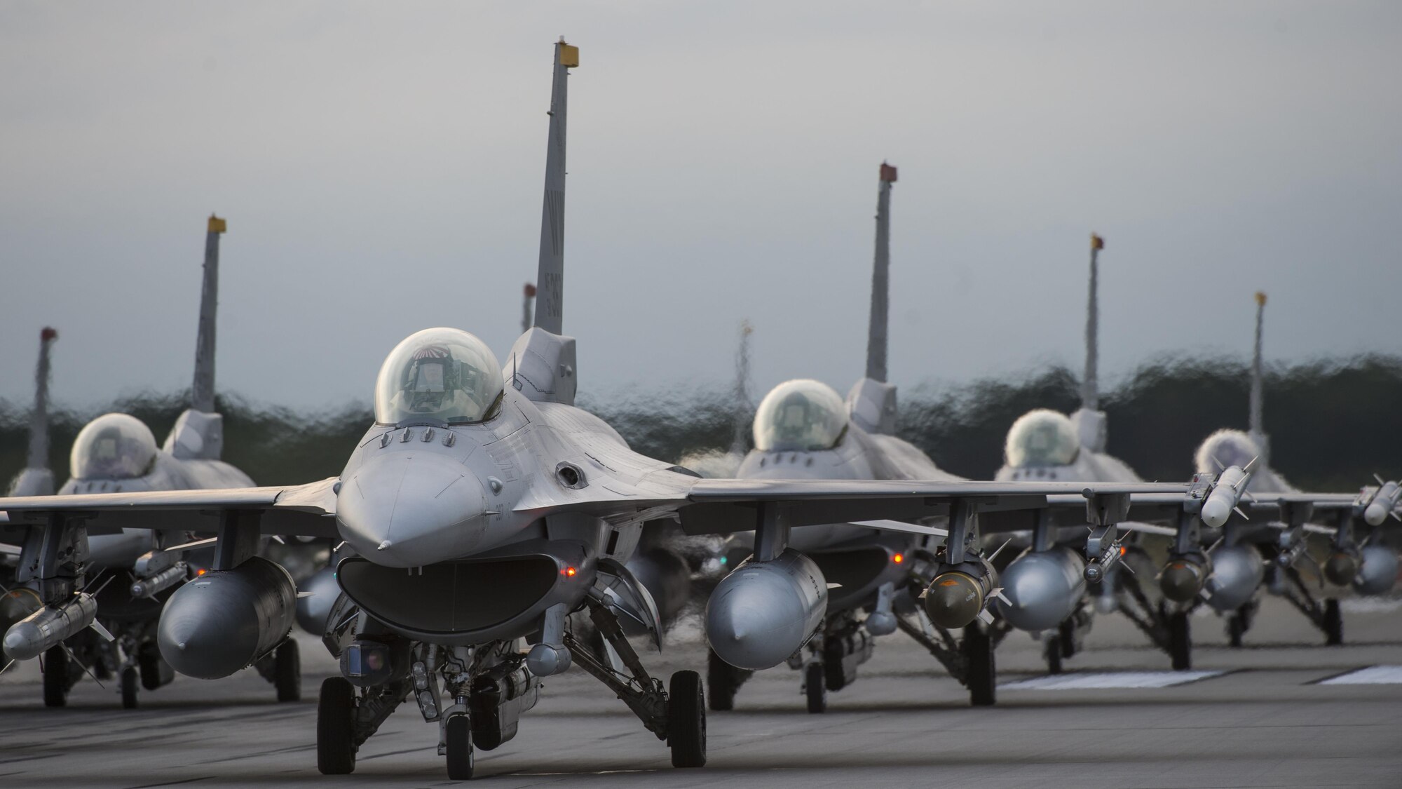 During Beverly Sunrise 17-07, an annual wing-wide readiness exercise planned months in advance, 18 F-16 Fighting Falcons from the 13th and 14th Fighter Squadron, line the runway during an elephant walk at Misawa Air Base, Japan, Sept. 16, 2017. BS 17-07 is a simulated deployment to test the readiness of the 35th Fighter Wing. The exercise assesses the 35th FW's ability to meet deployment and wartime taskings to better prepare for real-world scenarios throughout the Indo-Asia-Pacific region. (U.S. Air Force photo by Staff Sgt. Deana Heitzman)
