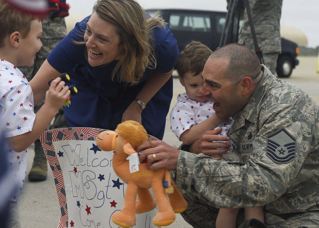 Master Sgt. Jeremiah Clarson, 192nd Maintenance Squadron quality assurance inspector, greets his family at Joint Base Langley-Eustis, Va., Oct. 12, 2017. Clarson was part of a total force integration deployment to Southwest Asia with the Virginia Air National Guard and the 1st Fighter Wing. (U.S. Air Force photo by Airman 1st Class Tristan Biese)