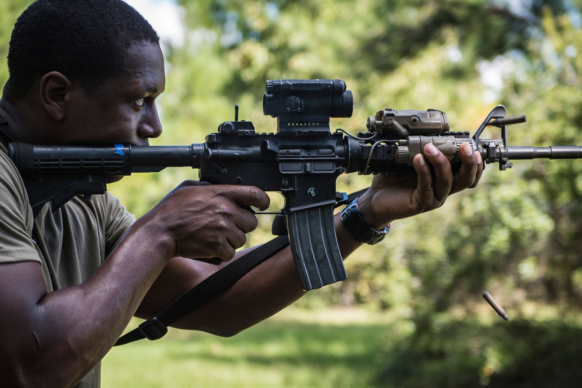 Staff Sgt. Brenton Brown, 822nd Base Defense Squadron fire team leader, fires an M4 rifle during a mission readiness exercise, Oct. 22, 2017, at Moody Air Force Base, Ga. The squadron was tested on their capability to effectively operate in an austere environment. (U.S. Air Force photo by Senior Airman Janiqua P. Robinson)