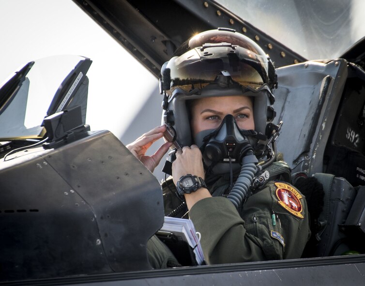 Capt. Zoe Kotnik, 55th Fighter Squadron pilot from Shaw Air Force Base, S.C., clips on her mask in her F-16 Fighting Falcon prior to a Combat Hammer sortie Nov. 2, 2017, at Eglin AFB, Fla.  A-10 Thunderbolt IIs, F-16s, F-22 Raptors and MQ-9 Reapers visited the base to participate in the 53rd Wing exercise. The 86th Fighter Weapons Squadron’s Combat Hammer is a weapons system evaluation program for air-to-ground munitions. (U.S. Air Force photo by Samuel King Jr.)