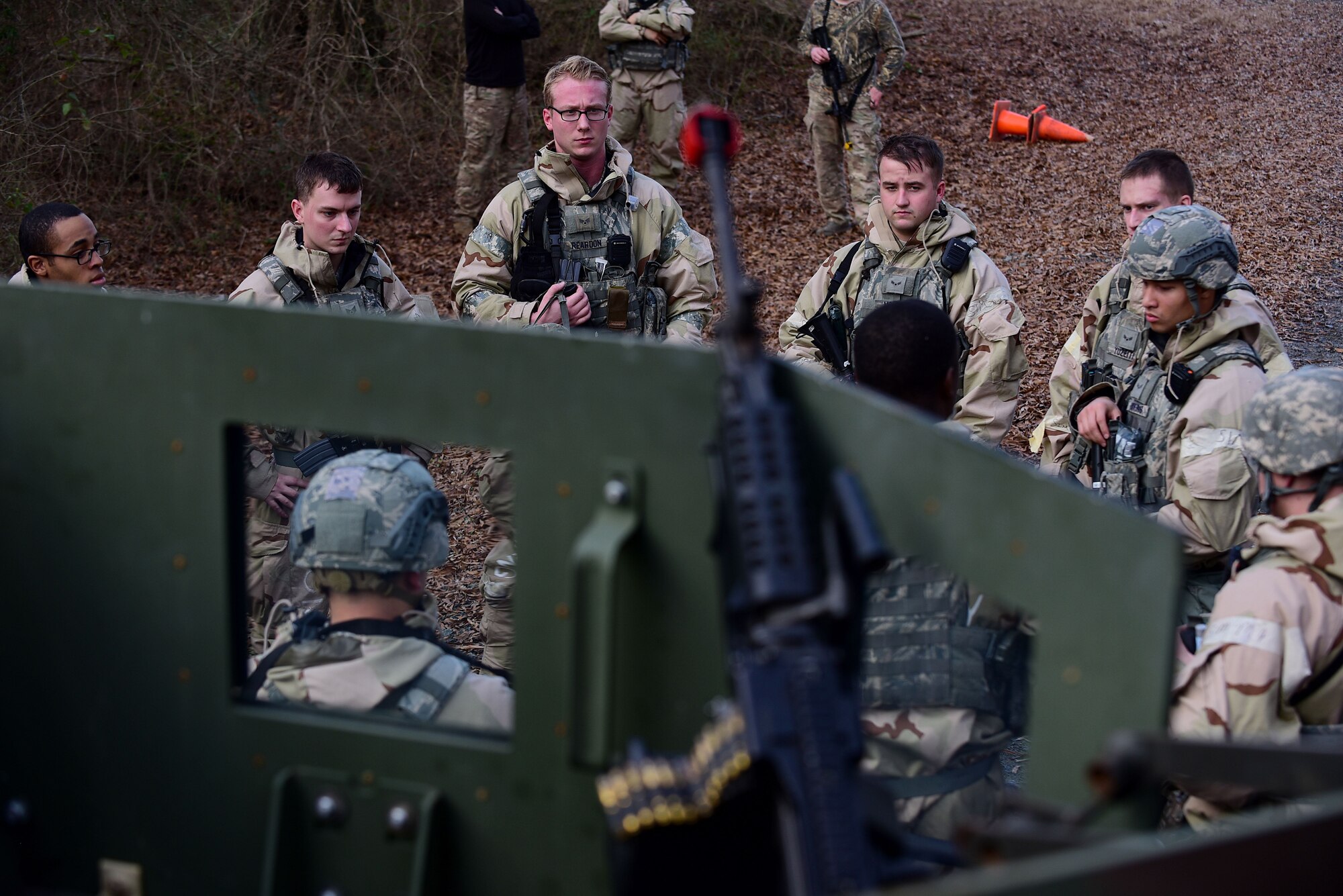 Airmen from the 4th Security Forces Squadron participate in a group briefing after a simulated attack during exercise Thunderdome 18-01, Jan. 11, 2018, at Seymour Johnson Air Force Base, North Carolina. Defenders of the 4th SFS immediately followed established procedures to respond to and neutralize the simulated threat. (U.S. Air Force photo by Airman 1st Class Kenneth Boyton)