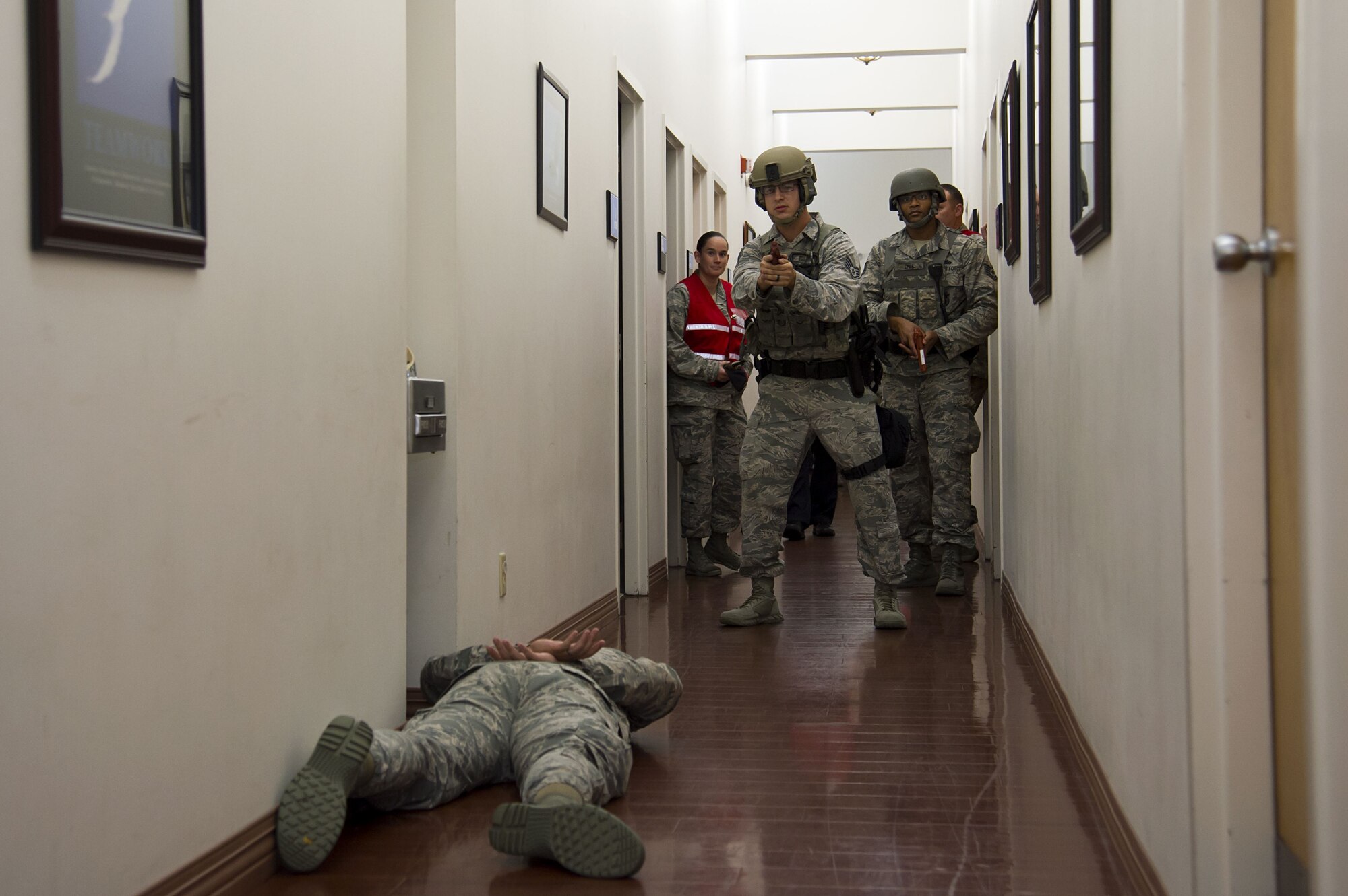 Airmen assigned to the 6th Security Forces Squadron interact with a simulated “victim” during an active shooter exercise at MacDill Air Force Base, Fla., Jan. 9, 2017. This exercise served as an opportunity for law enforcement and first responders to train on faster and better ways to respond to an active shooter situation.
