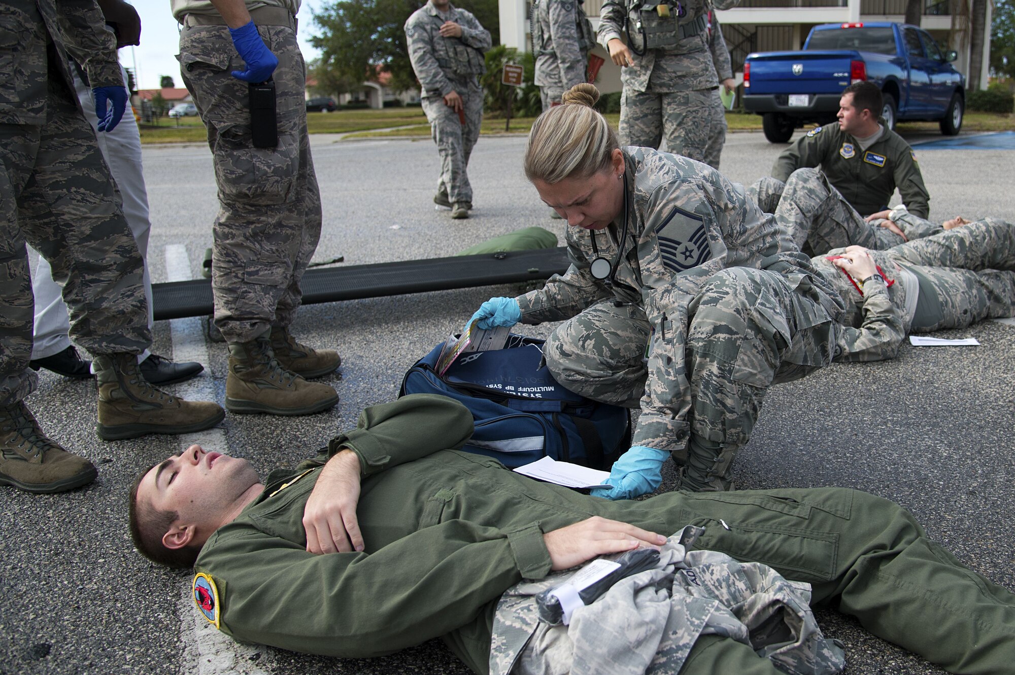 U.S. Air Force Senior Airman Jesse Barber, a boom operator assigned to the 50th Air Refueling Squadron, receives medical treatment for a simulated gunshot wound to the leg during an active shooter exercise at MacDill Air Force Base, Fla., Jan. 9, 2017. The exercise was an opportunity for medical first responders to train on initial care tactics.