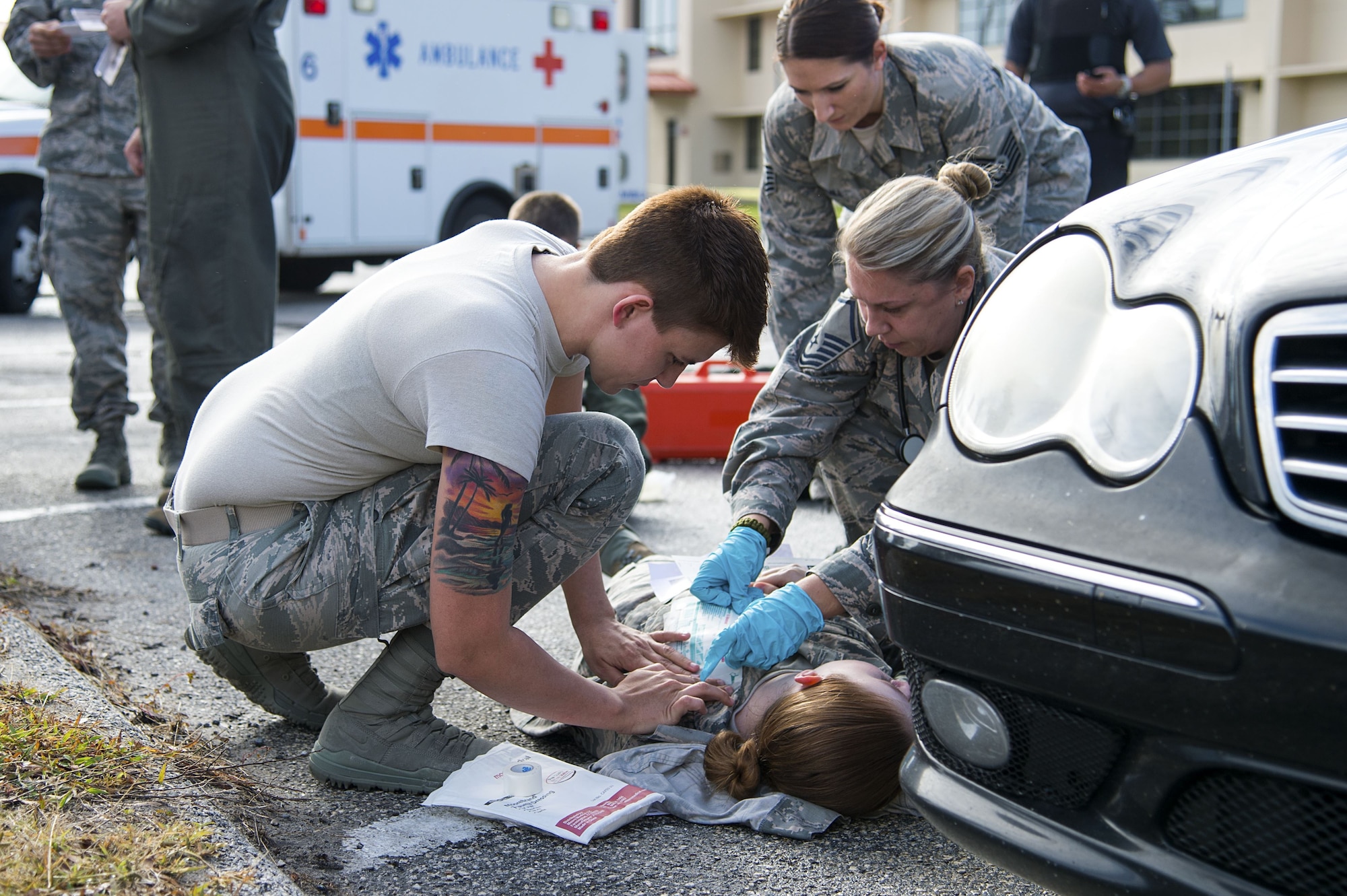 U.S. Air Force Airman 1st Class Stephanie Smith, an aviation resource manager assigned to the 6th Operations Support Squadron, receives medical treatment for a simulated gunshot wound during an active shooter exercise at MacDill Air Force Base, Fla., Jan. 9, 2017. The exercise was a way for the participating teams to practice effective teamwork and communication during a frantic situation.