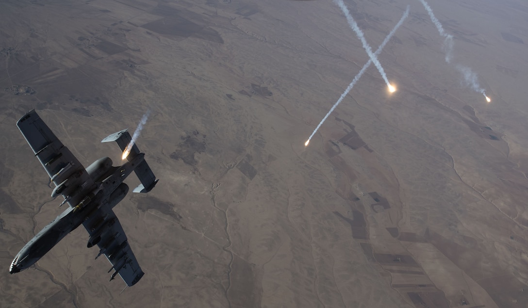 Countermeasures streak through the sky as an Air Force A-10 Thunderbolt II assigned to the 74th Expeditionary Fighter Squadron departs after refueling from a KC-135 Stratotanker over Syria.