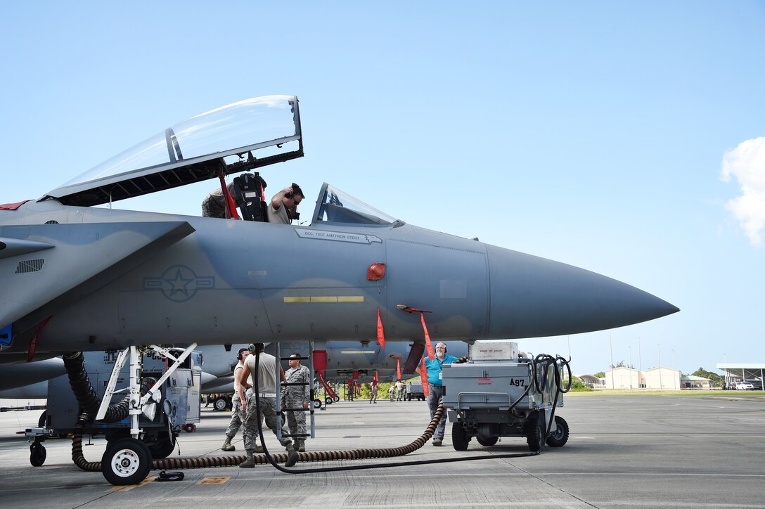 California Air National Guardsmen perform post-flight checks on an F-15C Eagle fighter aircraft.