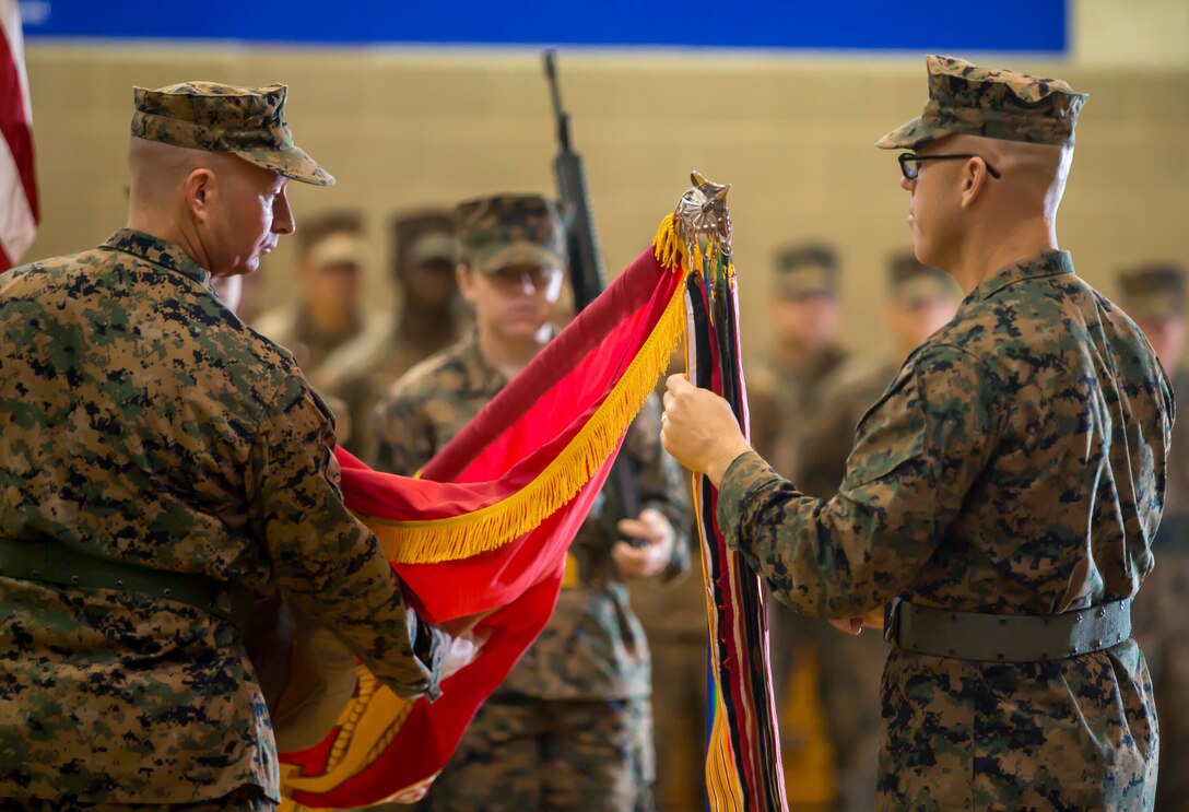 U.S. Marines with 11th Marine Regiment rededicate the regimental ribbons during a centennial ceremony at Marine Corps Base Camp Pendleton, Calif., Jan. 9, 2018.
