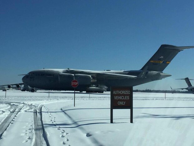 A 437th Airlift Wing C-17 Globemaster III sits on the Joint Base Charleston, South Carolina ramp after winter storm Grayson dumped up to 6 inches of snow on the Lowcountry Jan. 4, 2018.