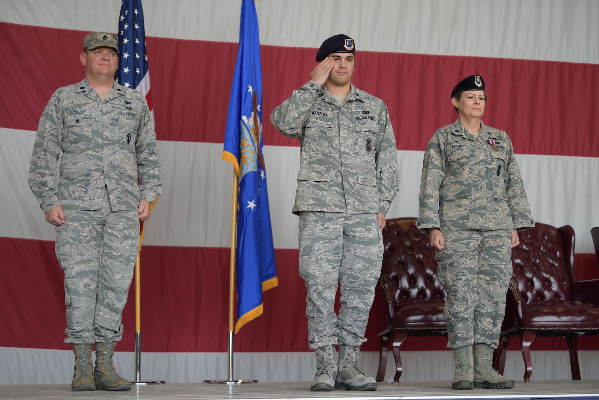 Capt. Jonathan Warzeka, 944th Security Forces Squadron incoming commander, renders his first salute to the Airmen of the 944 SFS after taking command during a ceremony held at Hangar 999, Jan. 6, 2018.