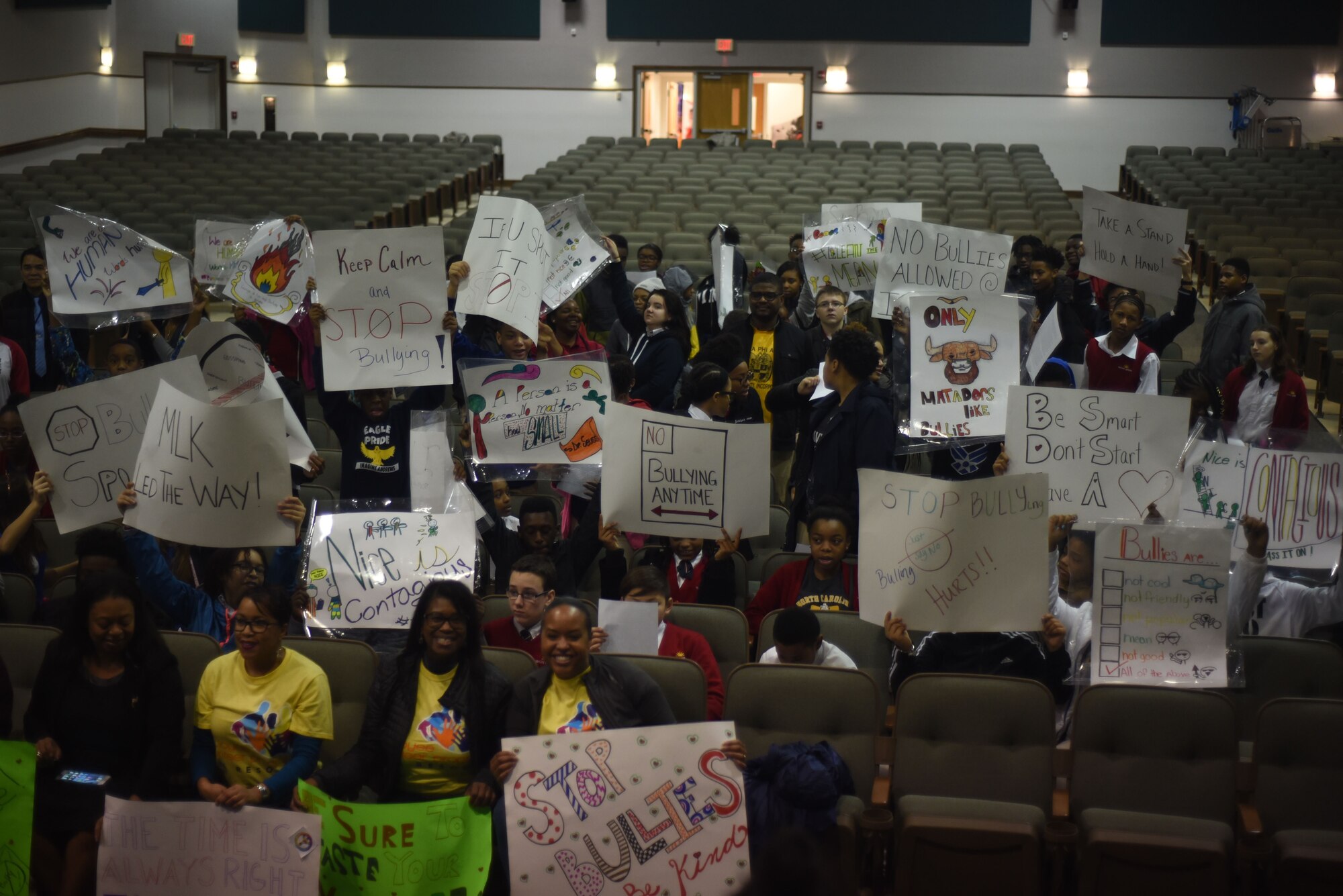 Stdents hold signs