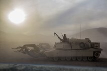 U.S. Marines with 3rd Battalion, 4th Marine Regiment, 1st Marine Division (MARDIV), execute a breach using a M1 Assault Breacher Vehicle during exercise Steel Knight (SK) 18 at Marine Corps Air Ground Combat Center, Twentynine Palms, Calif., Dec. 10, 2017.