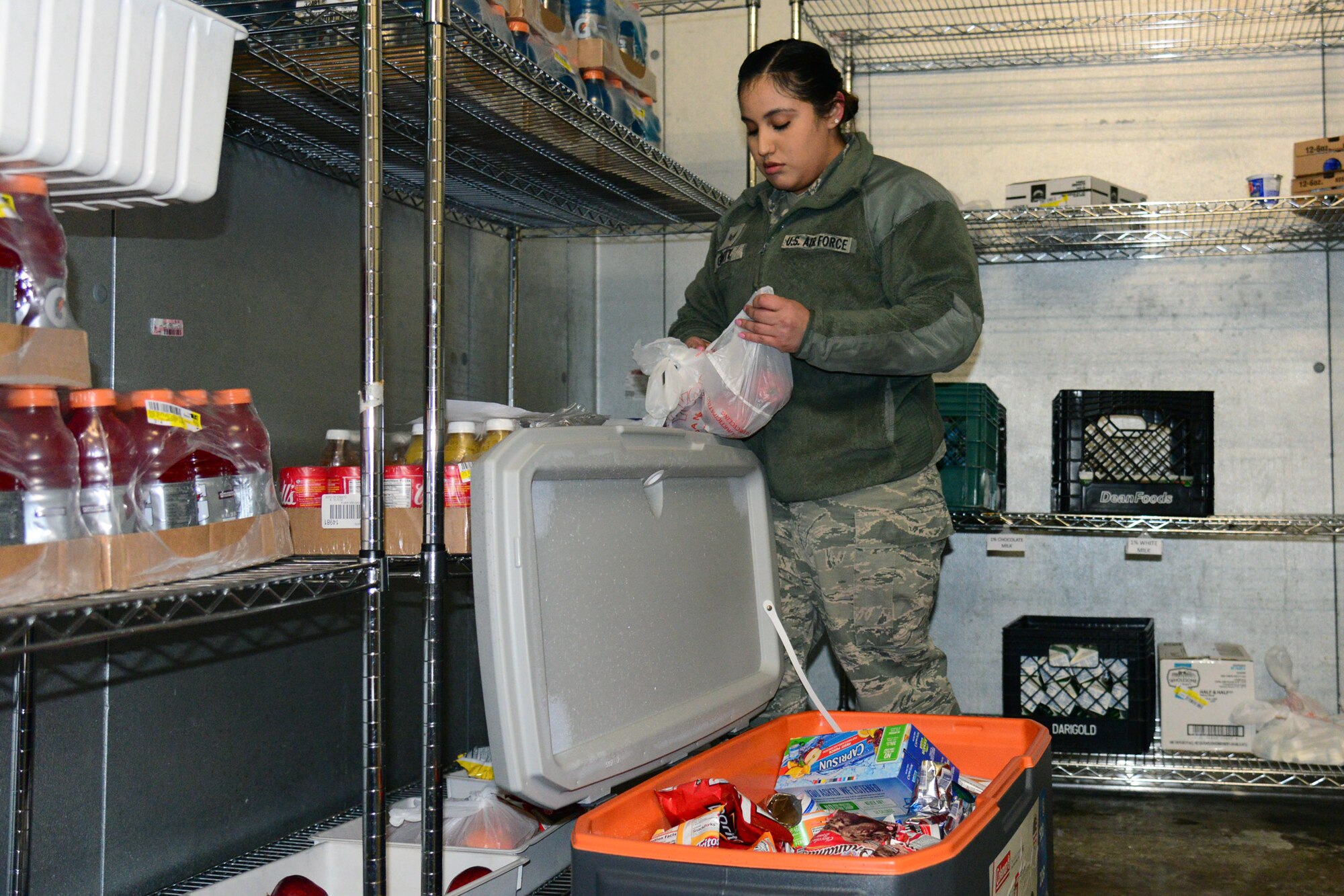 Senior Airman Alyssa Gantt, 341st Force Support Squadron accountant and store clerk, fills up a cooler Jan. 12, 2018, at Malmstrom Air Force Base, Mont.