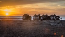 U.S. Marines with 1st Combat Engineer Battalion (CEB), 1st Marine Division, walk to their assault amphibious vehicles before a simulated amphibious breach in support of exercise Steel Knight 2018 at Marine Corps Base Camp Pendleton, Calif., Dec. 3, 2017.