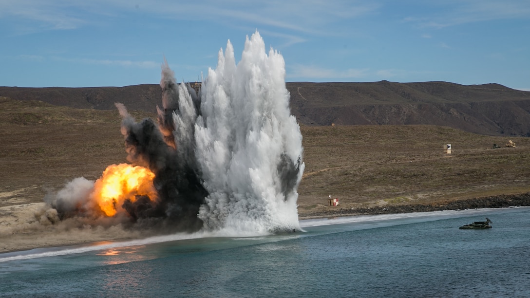 A U.S. Marine Corps amphibious assault vehicle with 1st Combat Engineer Battalion, 1st Marine Division, fires a mine clearing line charge during a simulated amphibious breach in support of exercise Steel Knight 2018 at San Clemente Island, Calif., Dec. 9, 2017.