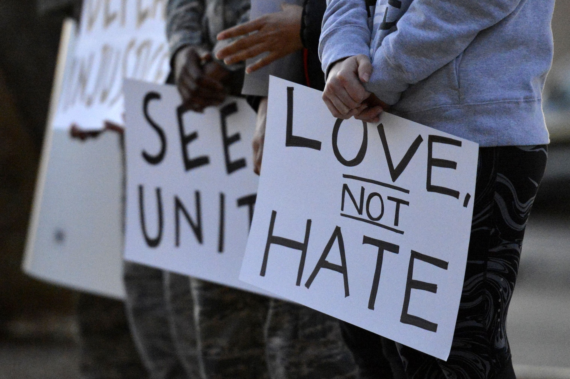 Airmen hold posters depicting principles of the Civil Rights Movement during a Martin Luther King Jr. Day remembrance march at Luke Air Force Base, Arizona, Jan. 12, 2018. Thunderbolts organized the special observance march to take place three days prior to the federal holiday celebrated Jan. 15. (U.S. Air Force photo/Airman 1st Class Caleb Worpel)