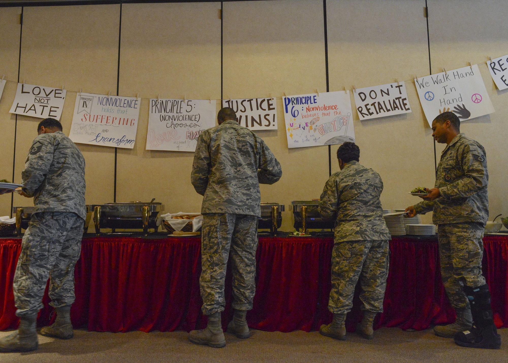 Airmen assigned to the 56th Fighter Wing serve themselves lunch during a Martin Luther King Jr. Day remembrance luncheon at Luke Air Force Base, Arizona, Jan. 12, 2018. The luncheon featured three guest speakers who reflected on Martin Luther King Jr’s life, legacy and contributions to the Civil Rights Movement. (U.S. Air Force photo/Airman 1st Class Caleb Worpel)