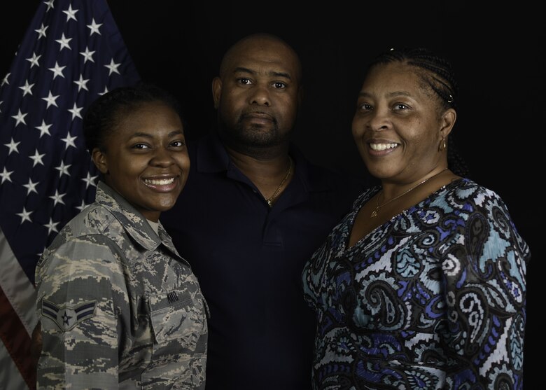 Airman 1st Class Paris Mayo, 380th Expeditionary Communications Squadron, client support technician, and her grandparents [Kelly and Areon Robinson] pose for a family portrait at Al Dhafra Air Base, United Arab Emirates Jan. 9, 2018. The Mayo and Robertson family have spent more than 50 years serving overseas. (U.S. Air National Guard photo illustration by Staff Sgt. Colton Elliott) (this image was created using blurring and cloning techniques)