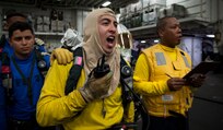 Sailors participate in an Aviation Training Team (ATT) drill in the hangar bay aboard the amphibious assault ship USS Wasp (LHD 1).