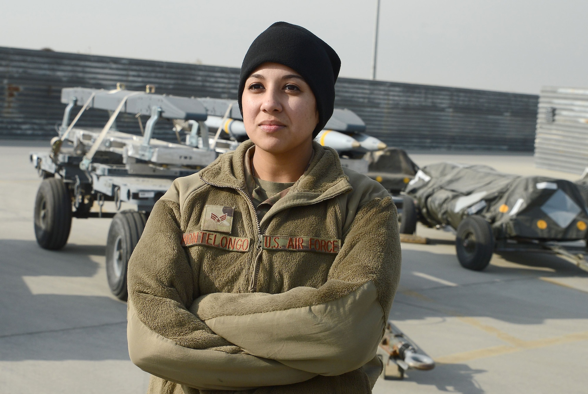 Senior Airman Alyssa Montelongo (left), 455th Expeditionary Maintenance Squadron ammo line delivery crew chief, poses for a photo Jan. 8, 2018 at Bagram Airfield, Afghanistan.