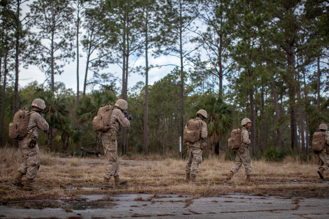 Marine Corps recruits perform a practice patrol.