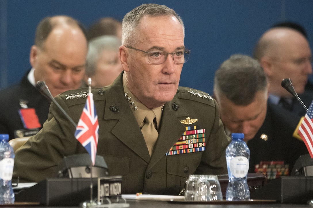 The chairman of the Joint Chiefs of Staff attends a NATO meeting.