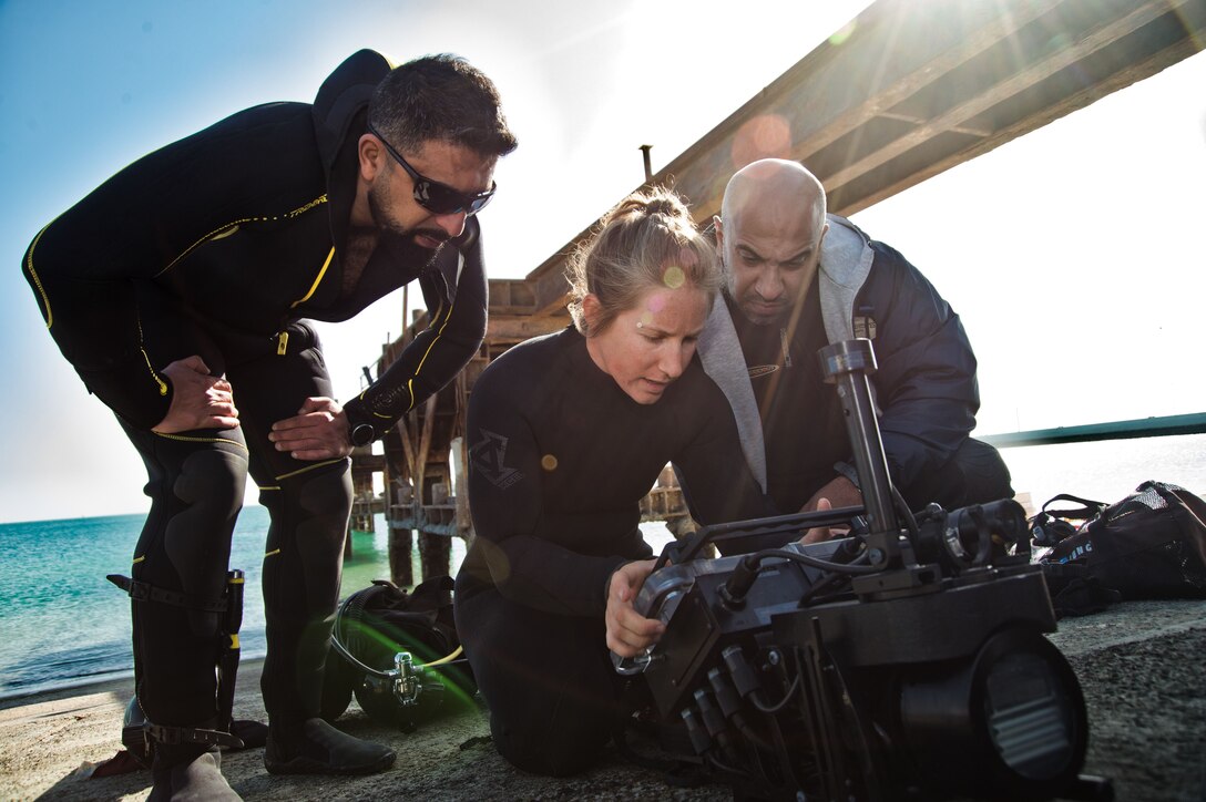 180108-N-XE158-0076 Mohammed Al-Ahmad Naval Base, KUWAIT (Jan. 8, 2018) Explosive Ordnance Disposal Technician 3rd Class Carolyn Willeford, assigned to Commander, Task Group 56.1, explains the basic functions of an underwater navigation system to Kuwait Naval Force explosive ordnance disposal technicians during a training evolution as part of exercise Eager Response 18. Eager Response 18 is a bilateral explosive ordnance disposal military exercise between the State of Kuwait and the United States. The exercise fortifies military-to-military relationships between the Kuwait Naval Force and U.S. Navy, advances the operational capabilities of Kuwaiti and U.S. forces to operate in the maritime domain, and enhances interoperability and warfighting readiness. (U.S. Navy photo by Mass Communication Specialist 1st Class Louis Rojas/Released)