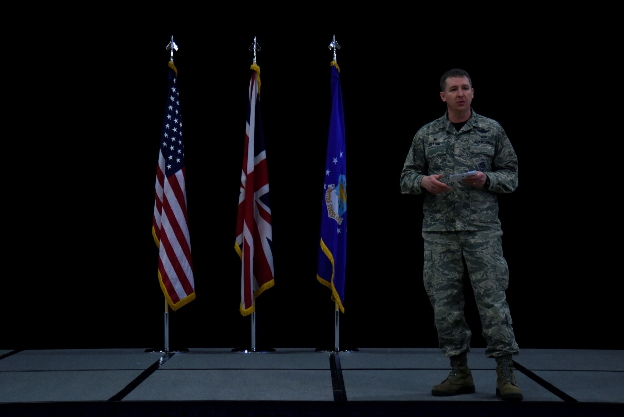 U.S. Air Force Col. Evan Pettus, 48th Fighter Wing commander, speaks to Liberty Wing Airmen during a wing all-call at Royal Air Force Lakenheath, England, Jan. 12. During the all-call, the commander discussed highlights of 2017 and recognized several outstanding Airmen. (U.S. Air Force photo/Senior Airman Abby L. Finkel)